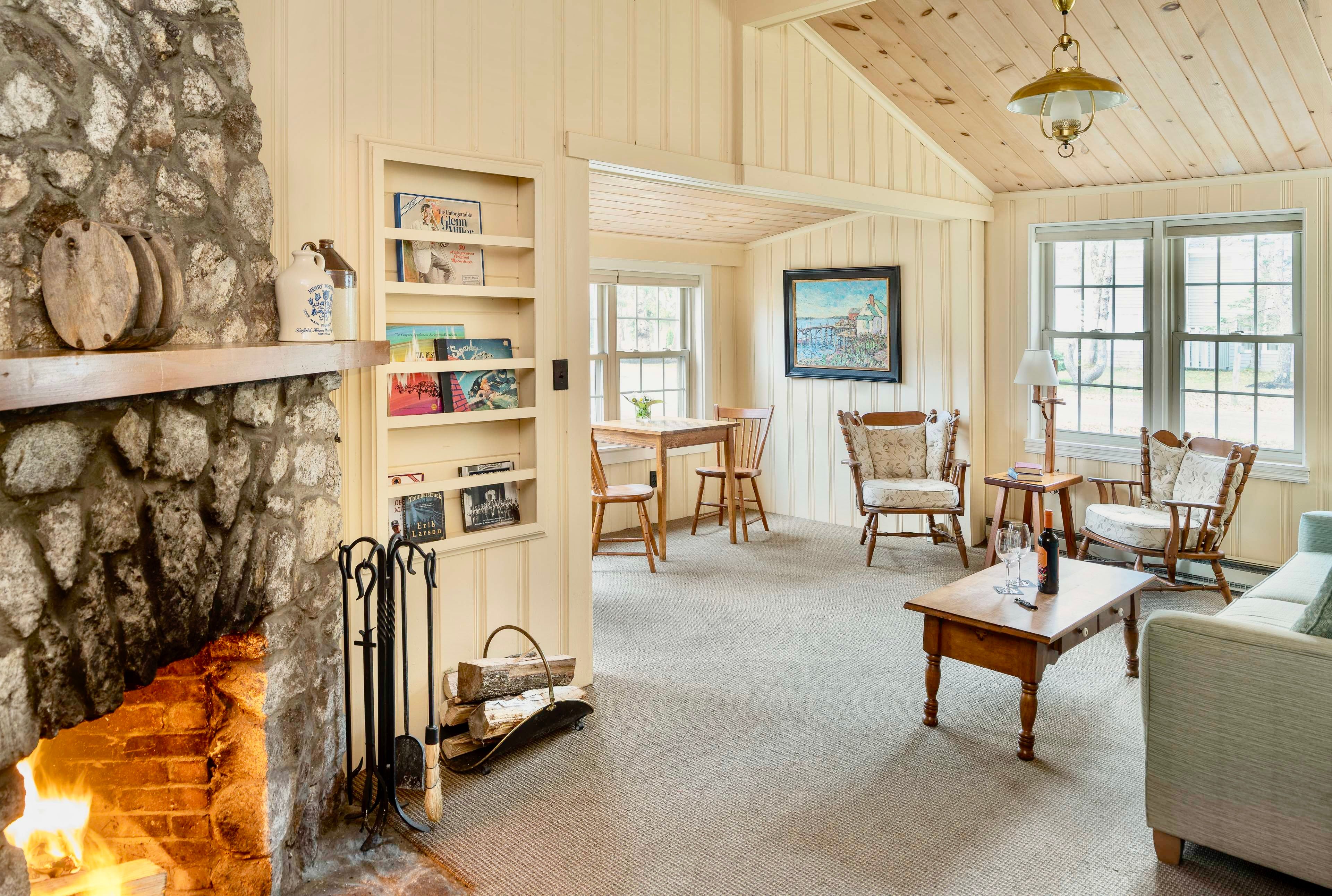 image Gather fireside in a sun-drenched cottage where timeless details and relaxed comfort set the mood for every season.