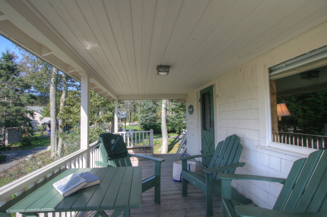 image Ease into a slower rhythm on this shaded porch, where forest views and fresh air invite you to linger.