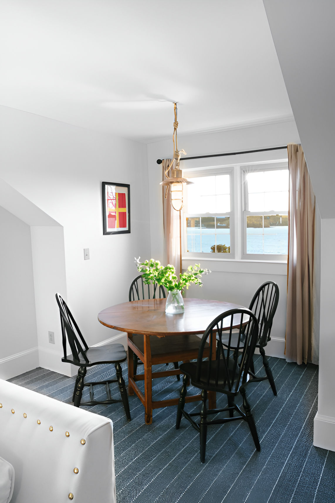 image Tucked beneath sloped ceilings, this intimate nook is perfect for slow breakfasts, card games, or sharing stories over coffee.