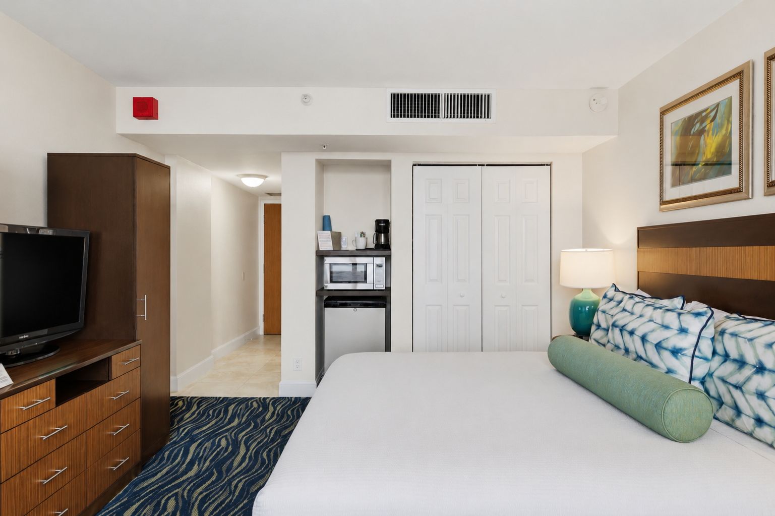 image Studio unit with king bed, kitchenette, and television