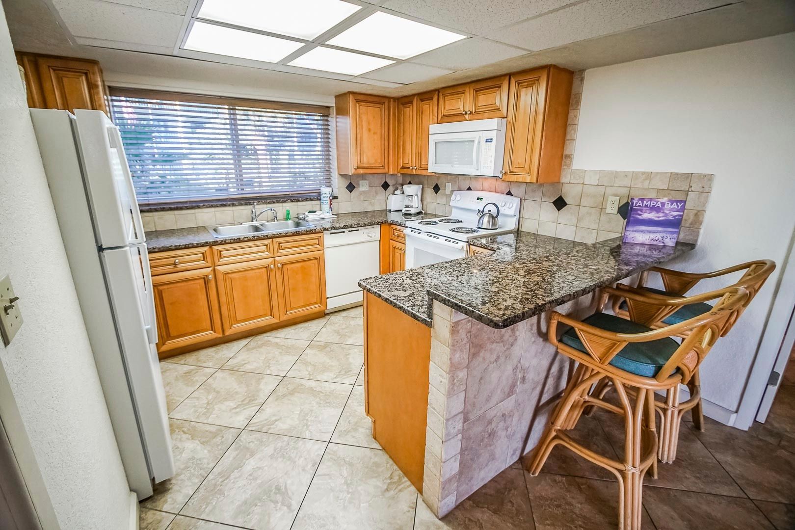 image This fully equipped kitchen features modern appliances, a spacious countertop, and ample cabinetry, perfect for preparing meals during your oceanview getaway.