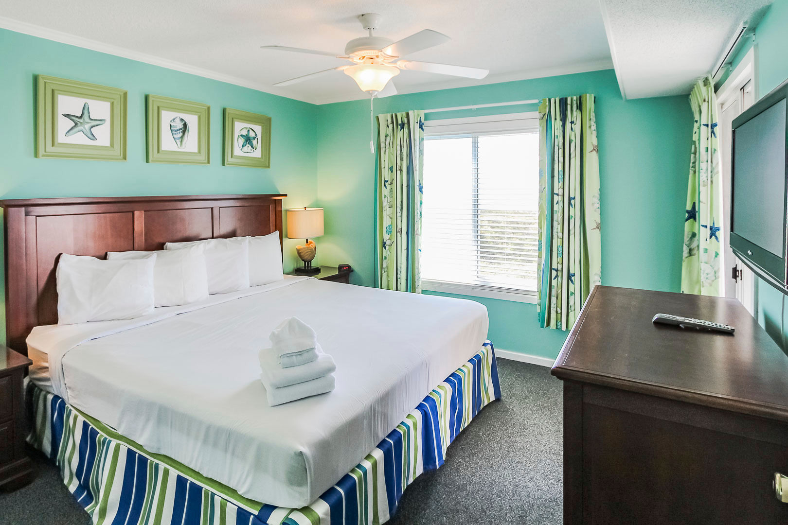 image This inviting master bedroom features a serene coastal color palette, a spacious king-sized bed, and ample natural light, perfect for family relaxation.