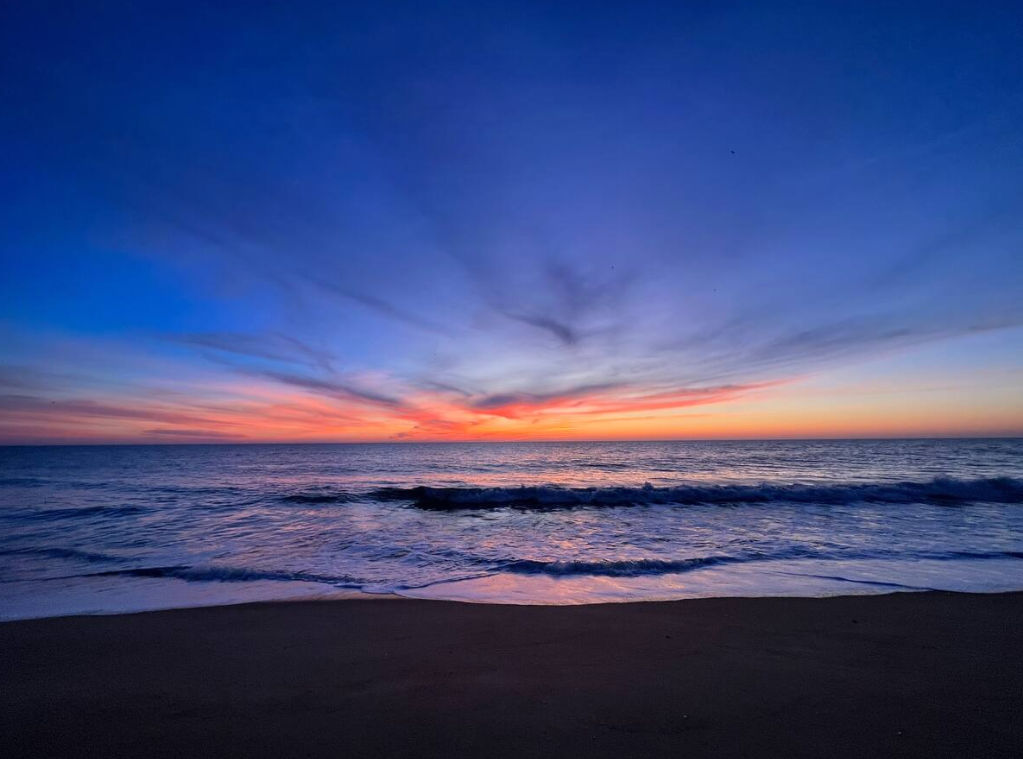image Experience breathtaking sunsets over the ocean from the sandy shores right outside your doorstep during your coastal getaway.