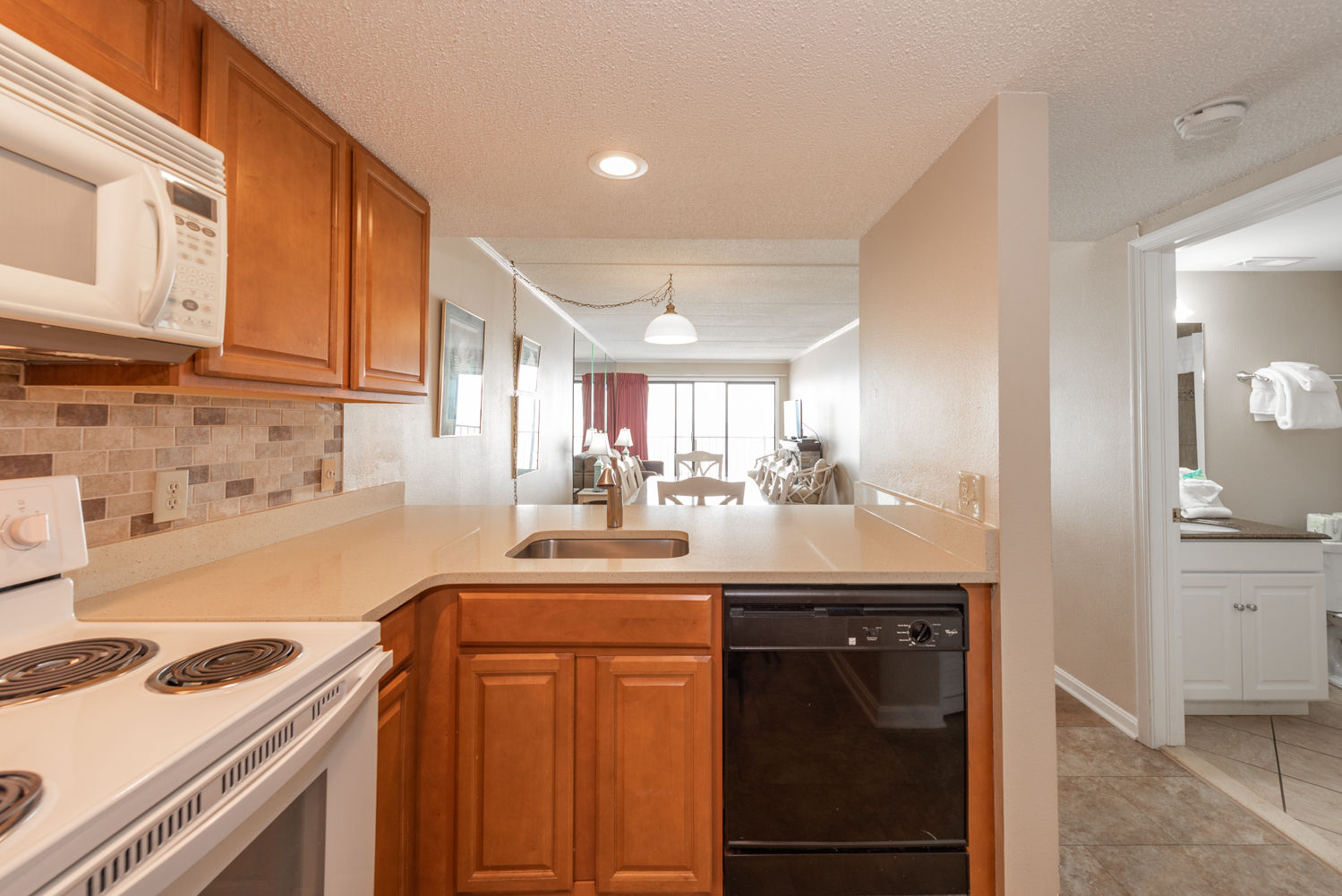 image Experience the convenience of a full kitchen in this spacious condo, perfect for family meals during your seaside getaway.