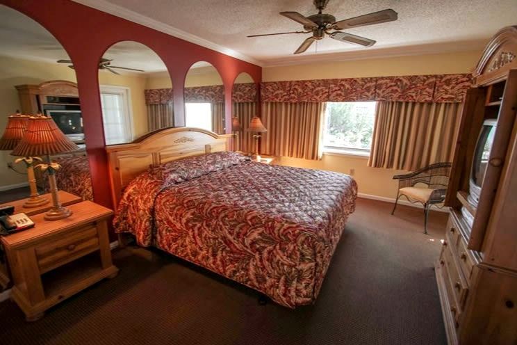 image The spacious bedroom provides a serene retreat with a comfortable bed and ample natural light, ensuring restful nights during your stay.