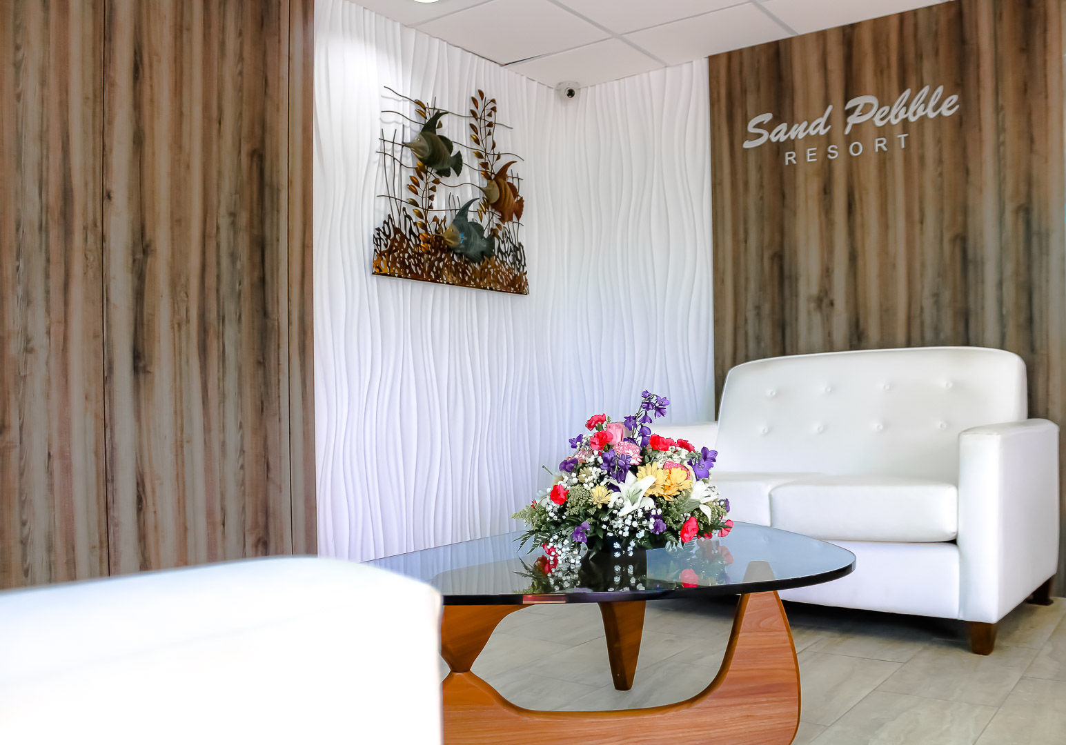 image Experience beachfront relaxation in this charming 2-bedroom efficiency condo at Sand Pebble, featuring cozy sleeping arrangements, a convenient kitchenette, and just a short stroll to John's Pass for dining and shopping.
