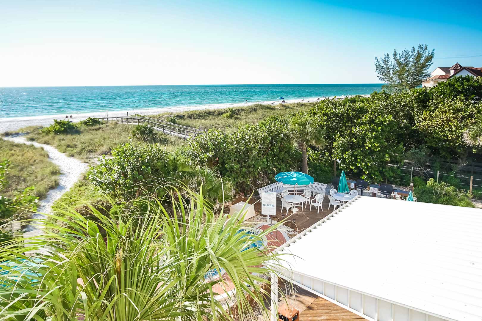 image Experience breathtaking beachfront views from the side-view balcony of this inviting 2BR condo at Sand Pebble in Treasure Island, FL.