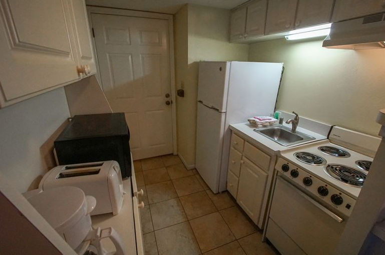 image Cook up your favorite meals in the efficient kitchenette, complete with essential appliances, making your beachfront getaway both convenient and enjoyable.