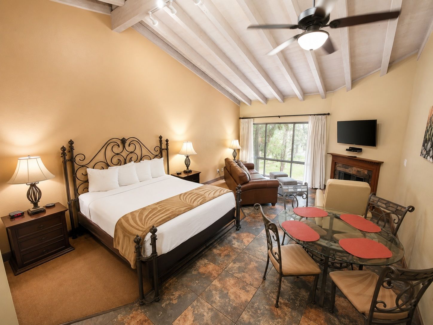 image Experience the perfect blend of comfort and style in your spacious studio, featuring high ceilings and tasteful furnishings, all set against a backdrop of nature's finest views.