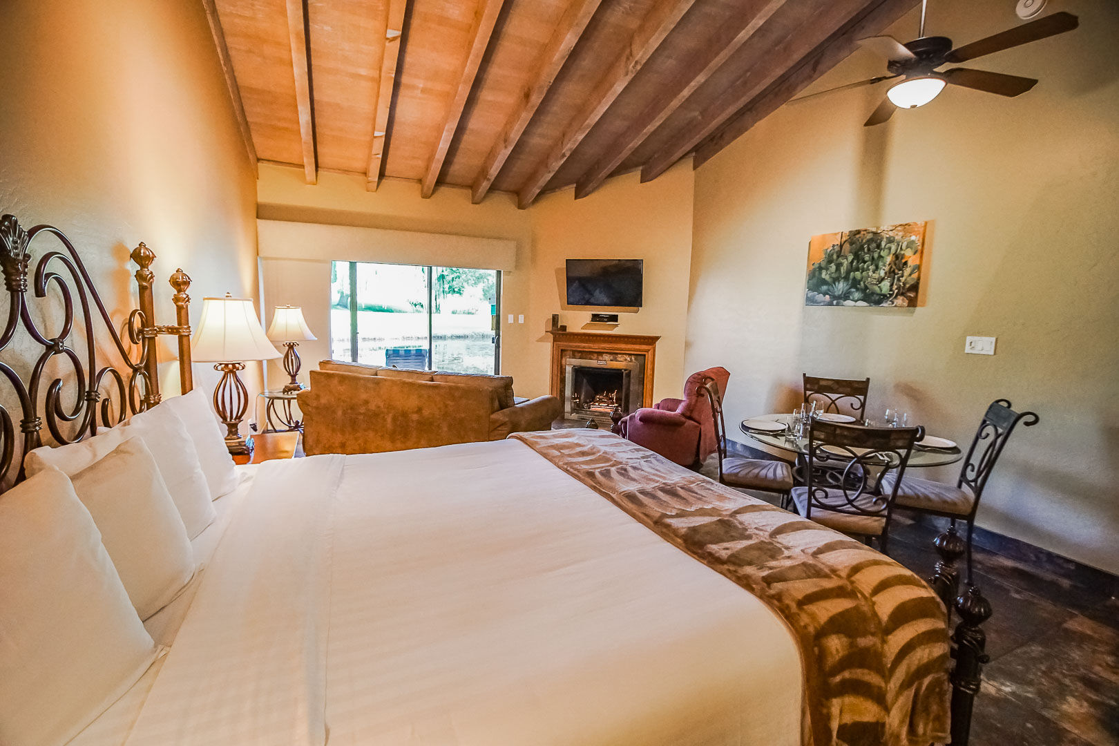 image Unwind in a cozy interior with a gas fireplace and inviting furnishings, offering a perfect escape for couples in Sedona's beautiful surroundings.