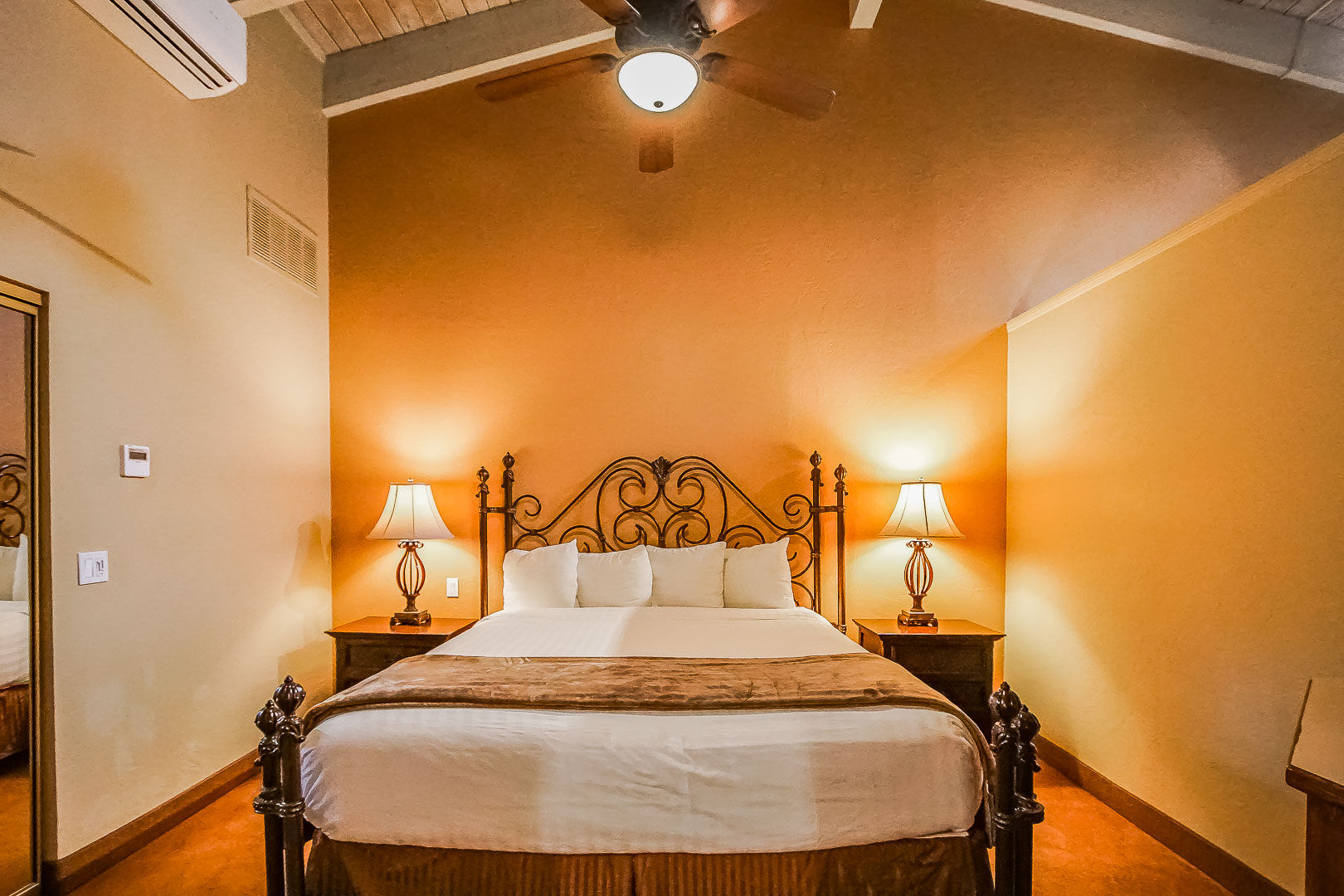 image Experience cozy relaxation in a charming bedroom featuring a plush king bed and warm lighting, perfect for a desert getaway.