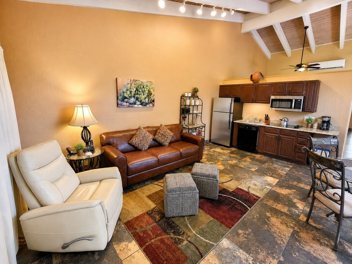 image An inviting interior featuring a cozy living space and partial kitchen, ideal for relaxation and family gatherings after a day of exploring Sedona.