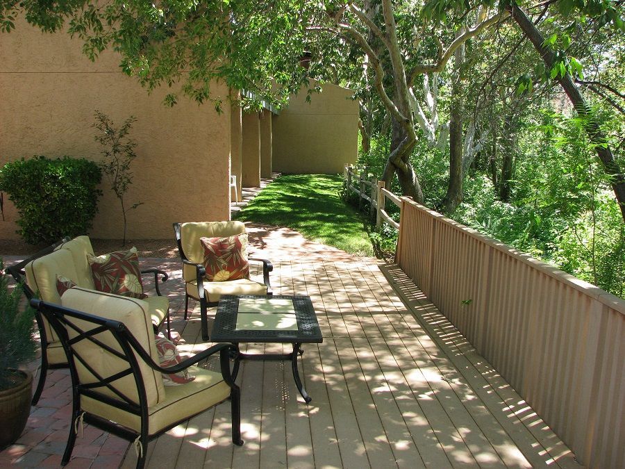 image Unwind on a private deck surrounded by nature, featuring comfortable seating for leisurely afternoons in the heart of Sedona’s picturesque desert.