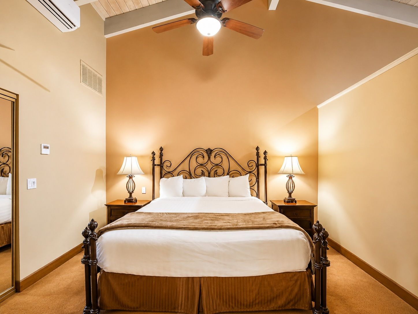 image Experience cozy relaxation in a charming bedroom featuring a plush king bed and warm lighting, perfect for a desert getaway.