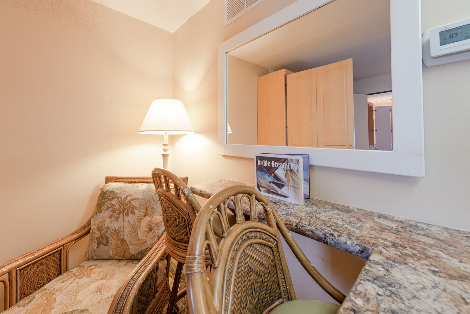 image A cozy nook with a breakfast bar and seating adds charm to the room, highlighting the convenient full kitchen available for preparing meals during your stay.