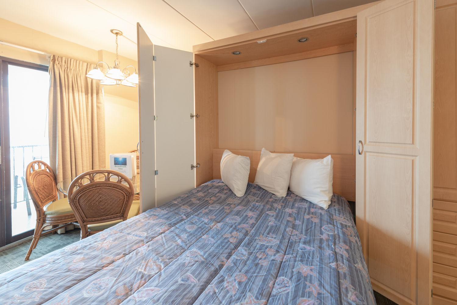 image Experience versatility in your stay with comfortable Queen Murphy beds that effortlessly transform your living space into a cozy retreat.