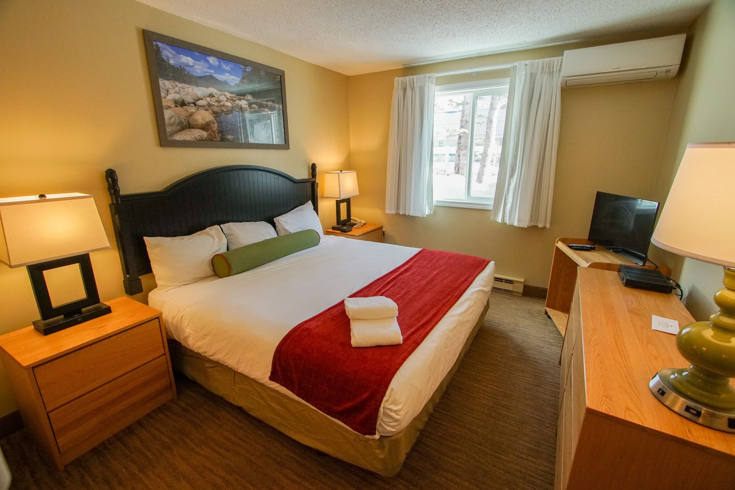 image Relax in a cozy bedroom with soft linens and natural light, perfect for a restful night's sleep.