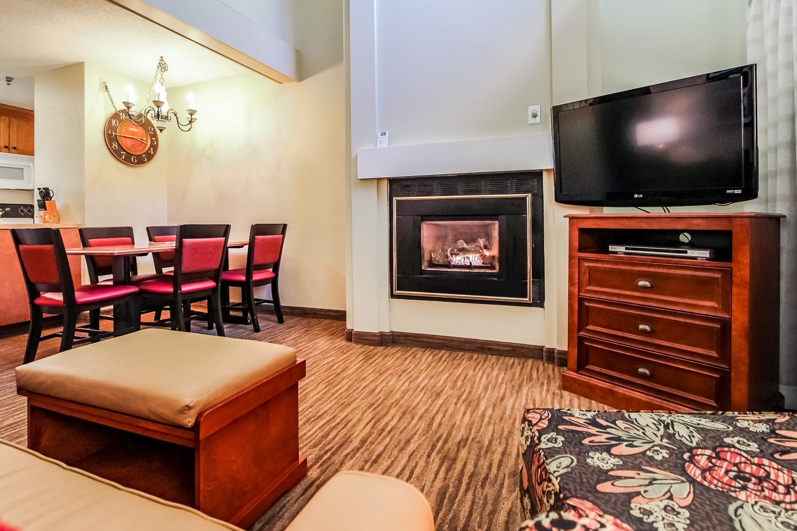 image Cozy and inviting living space with a fireplace lounge and dining area, ideal for relaxing after a day of skiing or hiking.