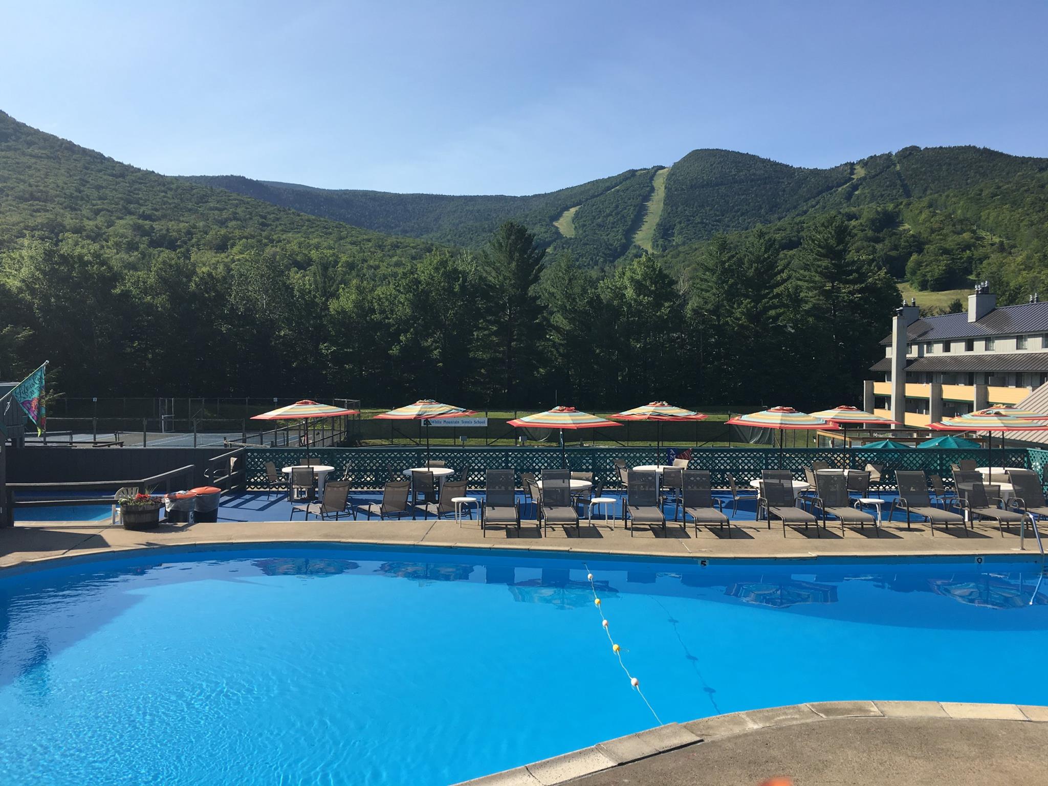 image With breathtaking mountain views, this pool area is perfect for families to enjoy sunny days, making it an ideal retreat after a day spent hiking or enjoying winter sports.