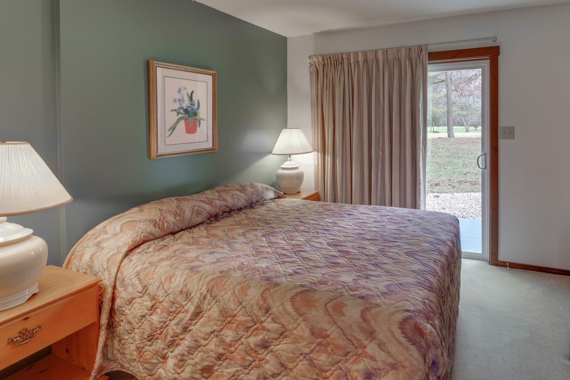 image Main-level bedroom with a cozy queen bed and soft natural light—ideal for restful nights.