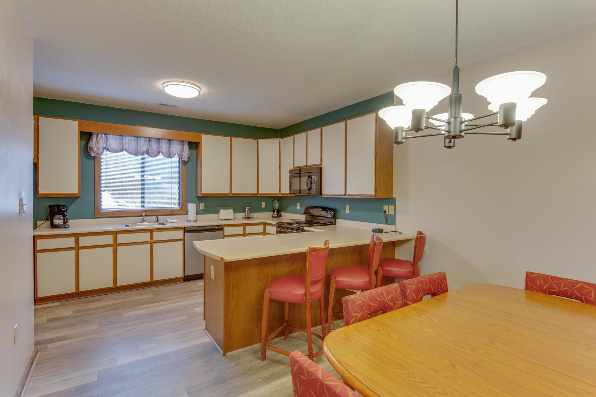 image Spacious kitchen and dining area with full-size appliances—great for home-cooked meals and gatherings.