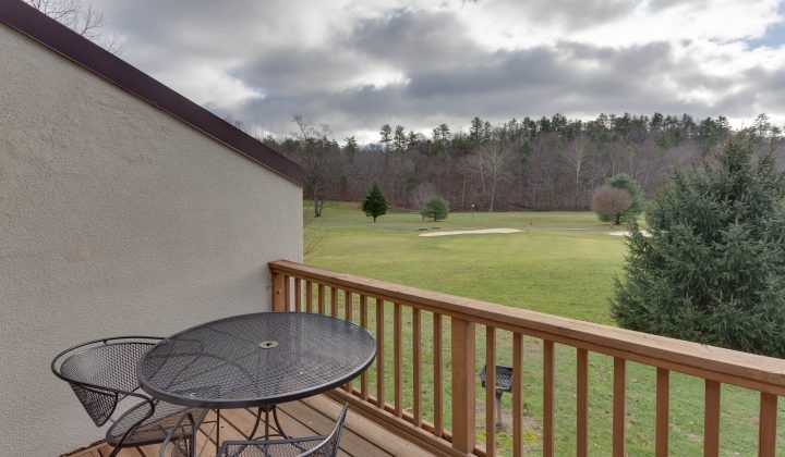 image Relax on your private balcony with a cozy table set for two, offering serene views of the surrounding landscape—ideal for morning coffee or evening star-gazing.