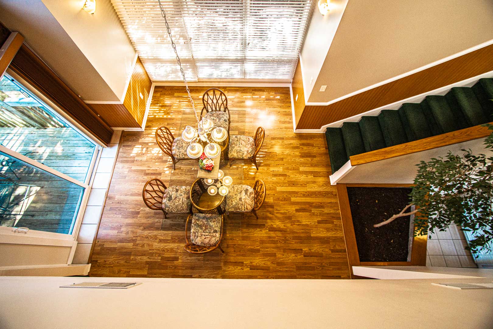 image This dining area, bathed in natural light, offers ample seating for family meals, enhancing the townhouse's inviting and spacious layout perfect for creating lasting memories.