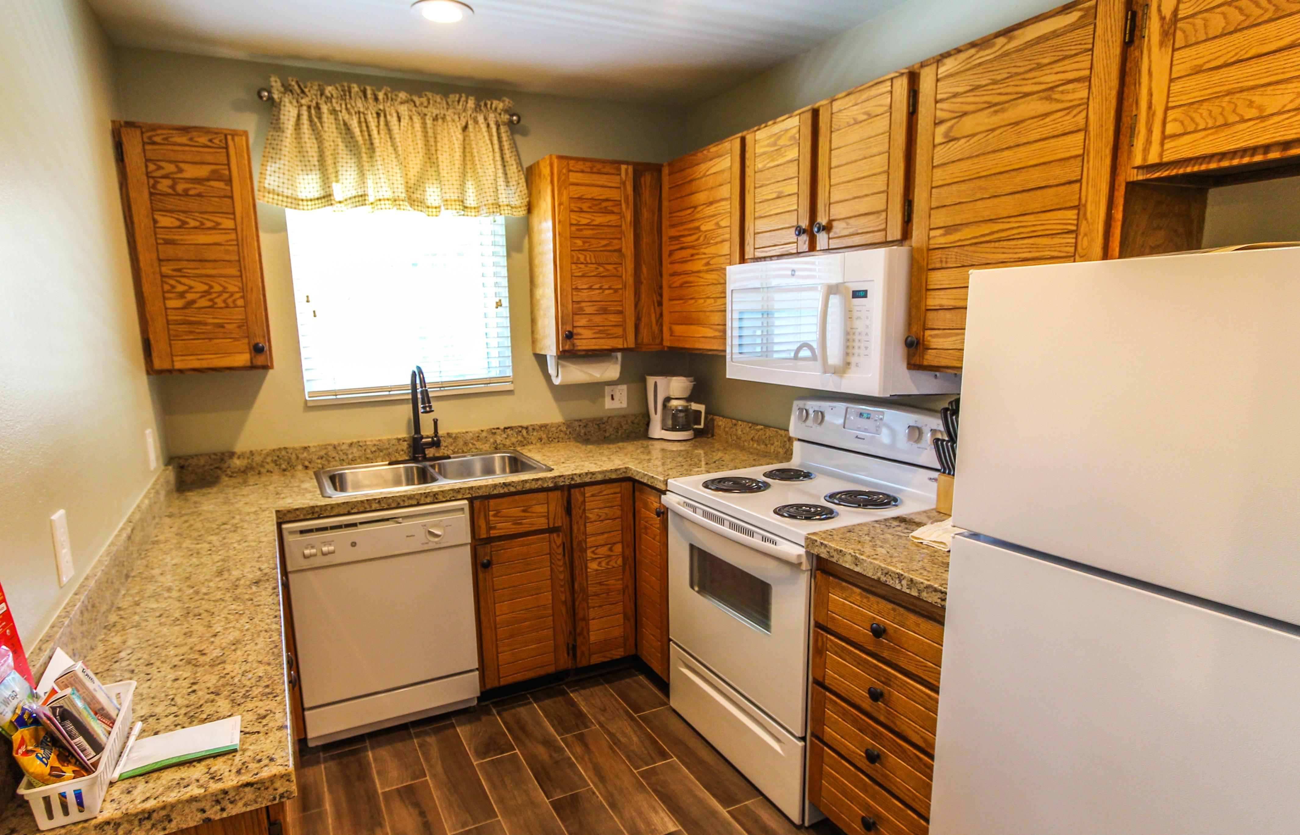 image With modern appliances and ample counter space, this fully equipped kitchen is perfect for preparing meals, making your stay convenient and enjoyable in the heart of the mountains.