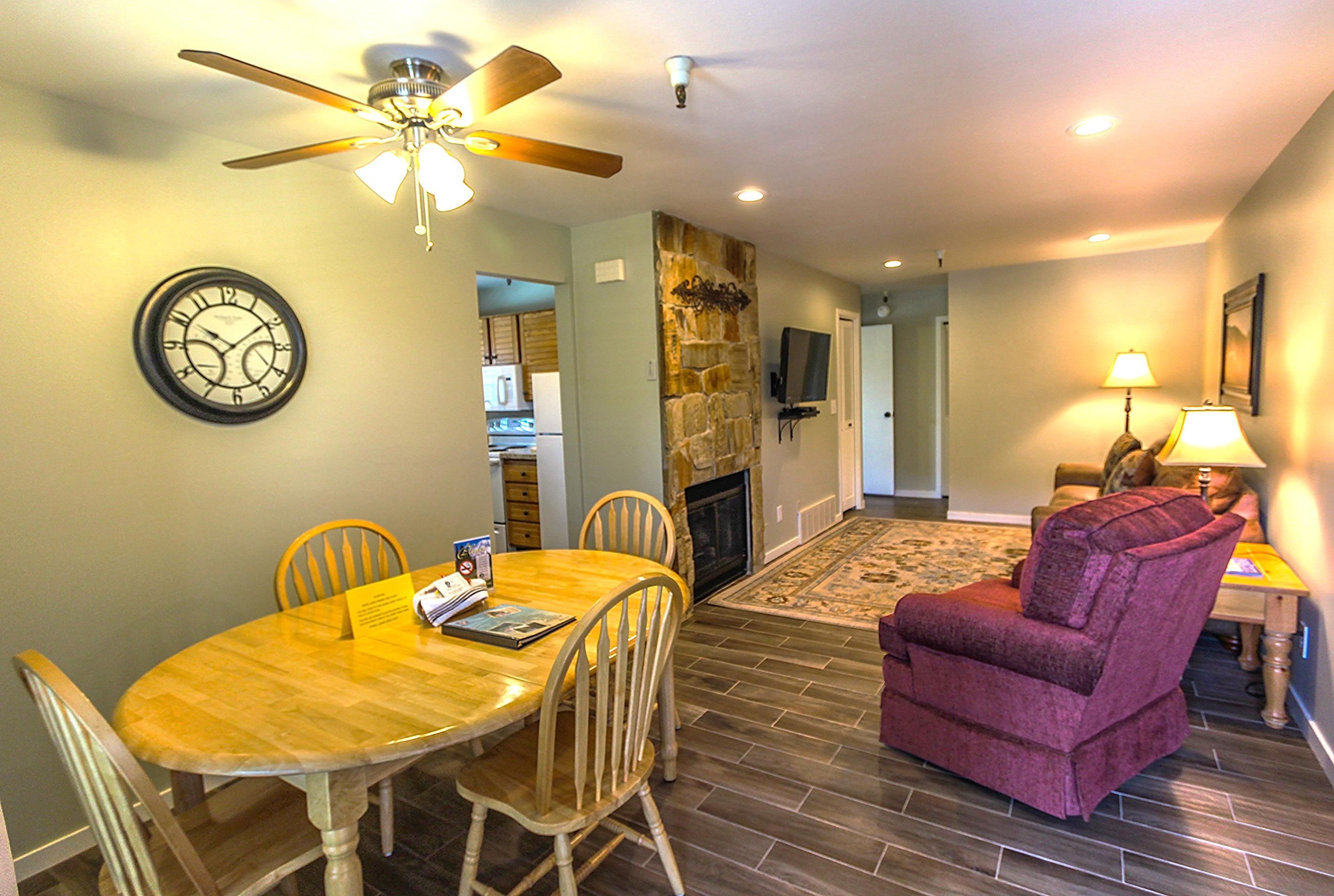 image A welcoming dining space with a charming wooden table and chairs complements the cozy living area, offering a great spot to unwind next to the fireplace while enjoying the ambiance of your ski getaway.