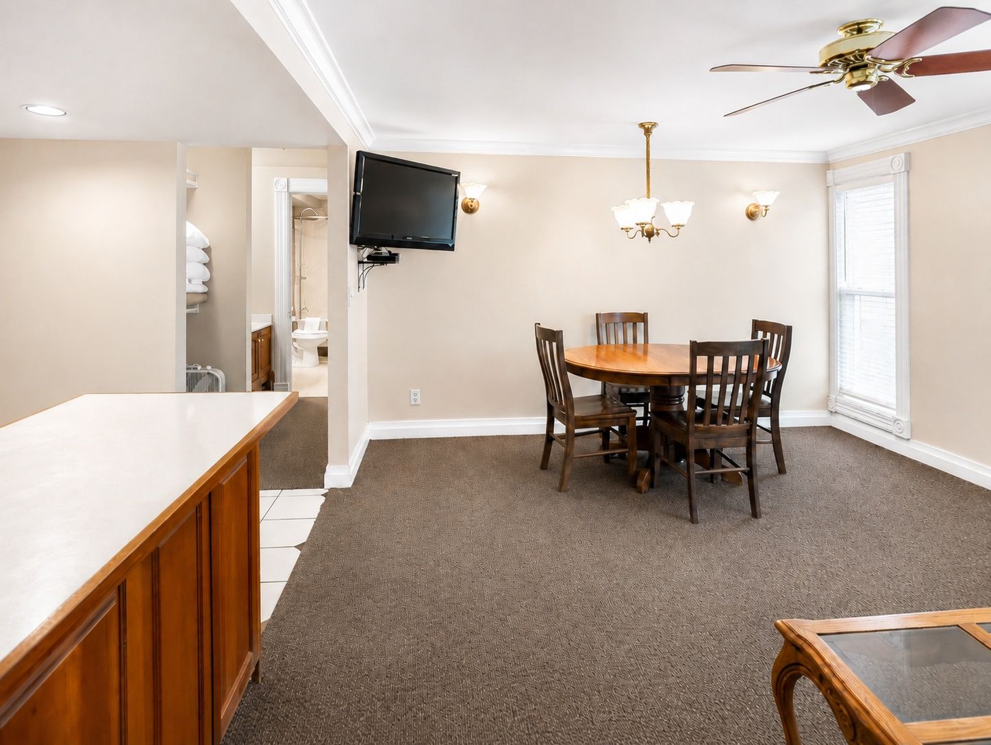 image Dining space with table, TV, and open layout.