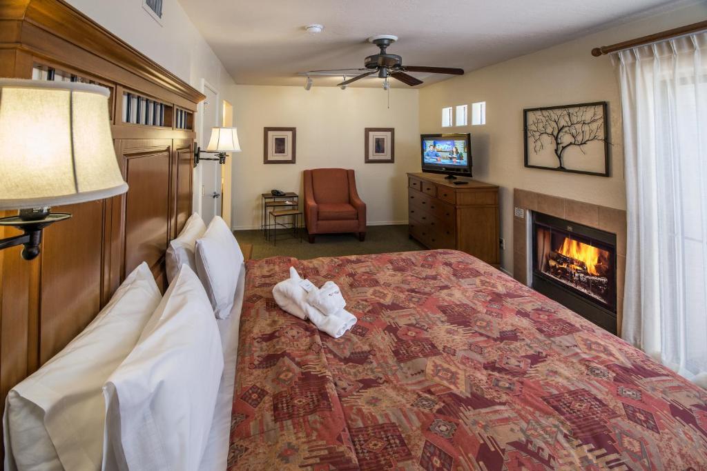 image A inviting master bedroom featuring a king bed, a cozy fireplace, and contemporary decor, perfect for relaxation.