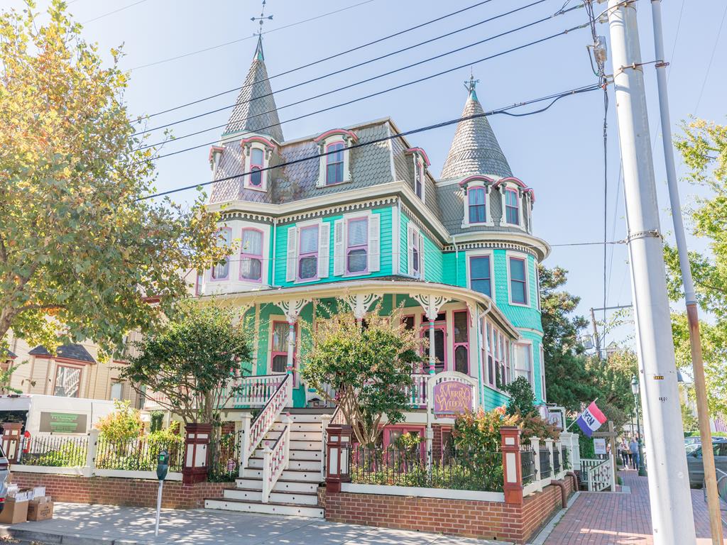 image This vibrant Cape May penthouse boasts a charming exterior with classic architecture, beautifully setting the stage for a luxurious stay just a block away from the beach.