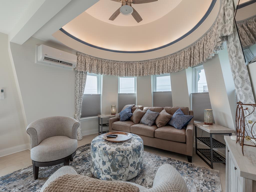 image Inside, the turret sitting area provides a cozy retreat, with ample natural light pouring through the windows, making it the ideal spot to unwind.