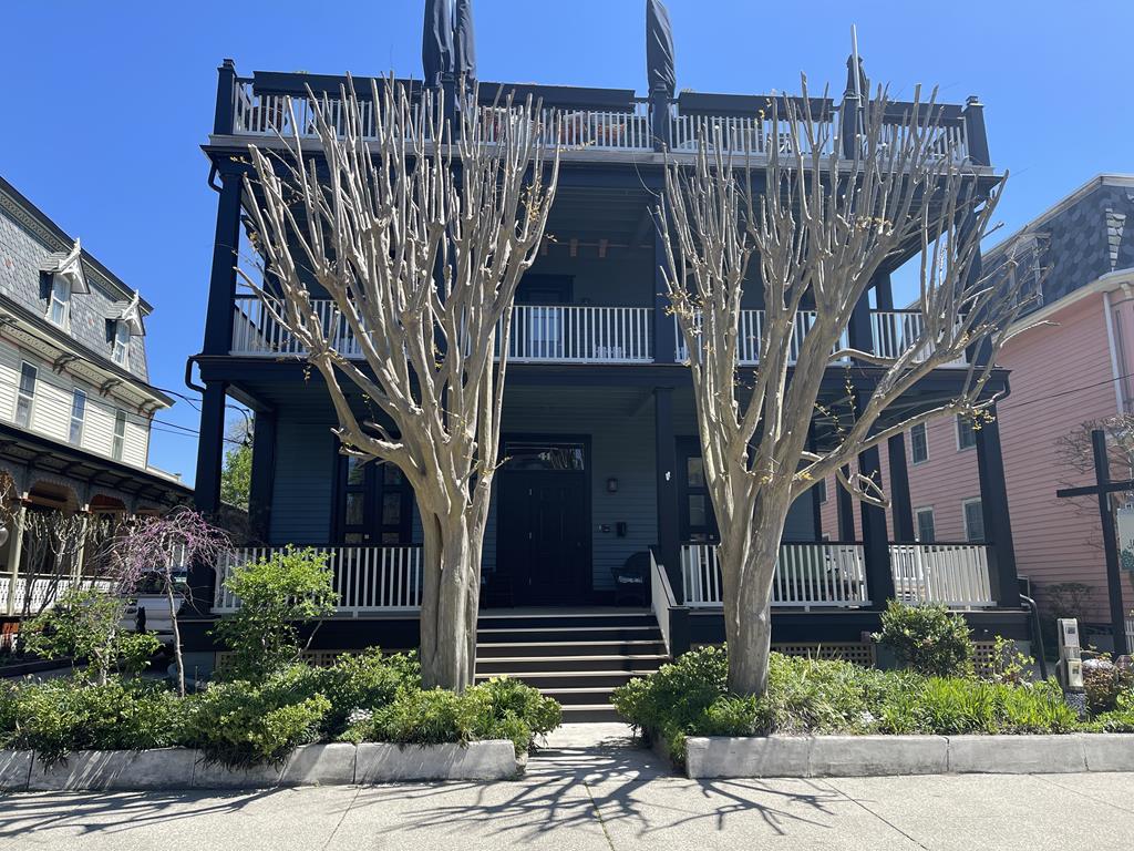 image Discover this charming beach block property featuring a shared porch and BBQ patio ideal for outdoor gatherings.