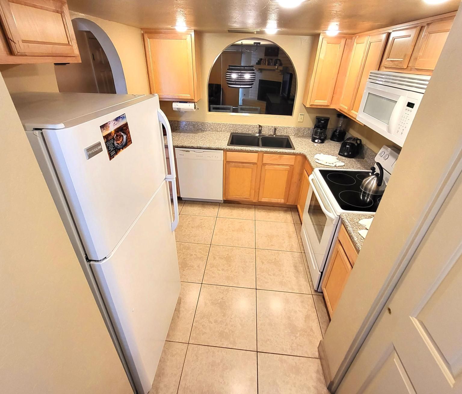 image This fully equipped kitchen features modern appliances and ample counter space, making cooking a delightful experience amidst your stay.