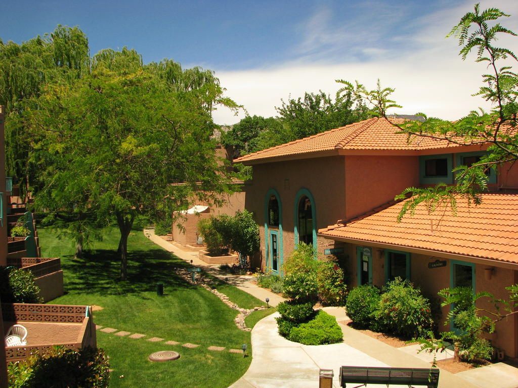 image Enjoy serene red rock views and lush greenery from your balcony at this beautifully landscaped property with direct access to hiking trails.