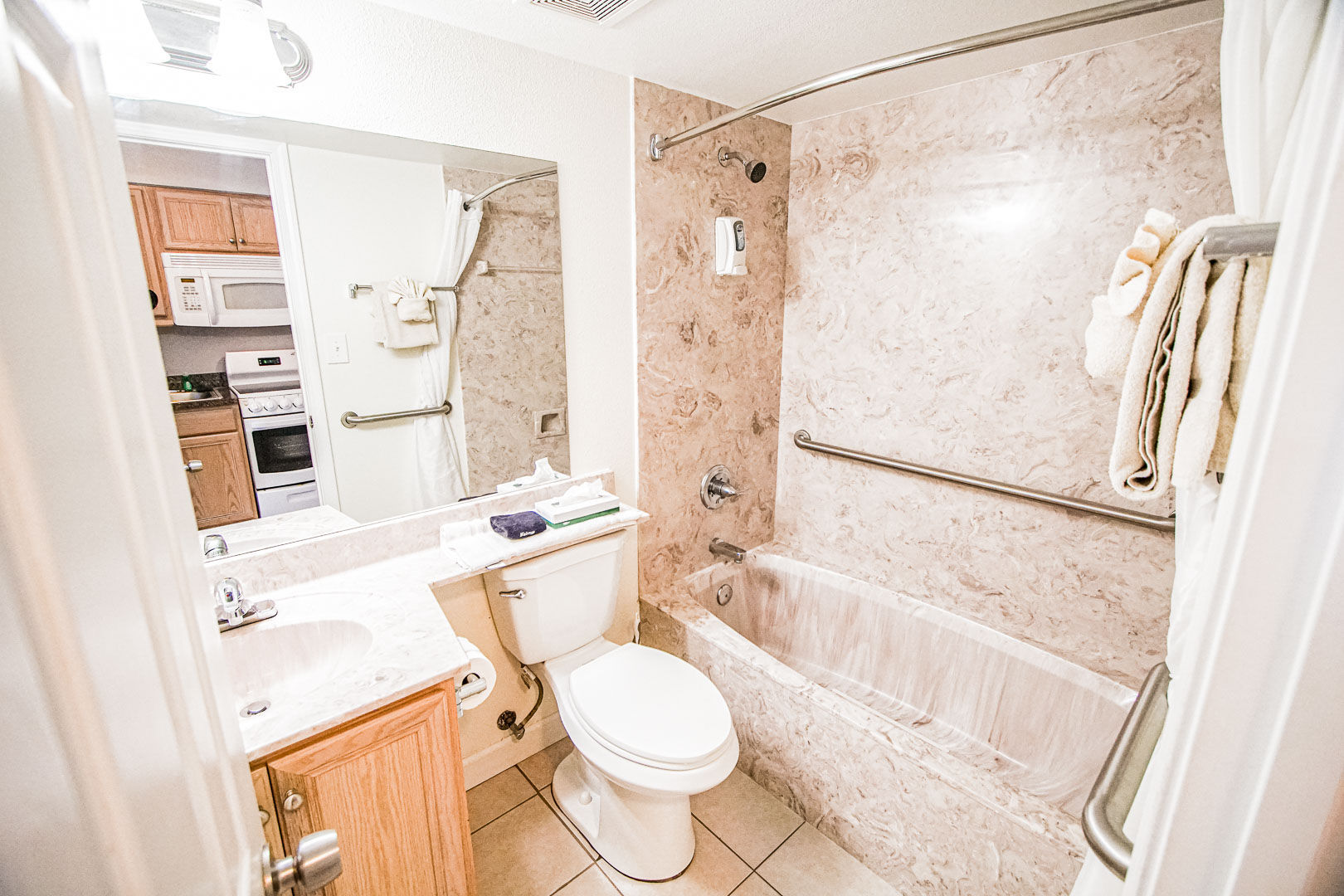 image The bathroom features a sleek marble design, equipped with essential amenities for a refreshing stay, including a spacious bathtub and modern fixtures.