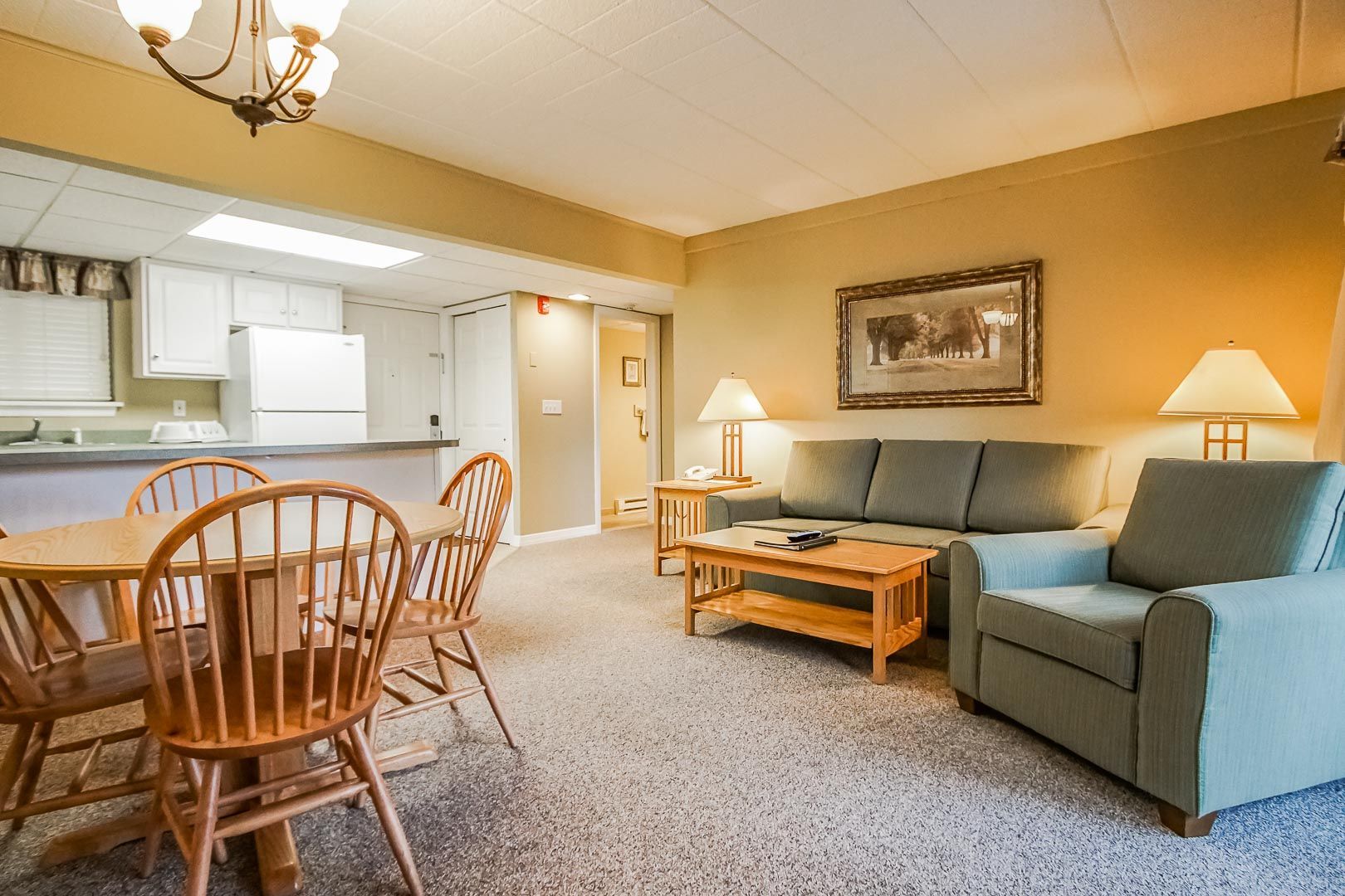 image The bright, open living space seamlessly connects to a full kitchen, making it perfect for families looking to unwind and enjoy their stay near Lake Wallenpaupack and local golf courses.