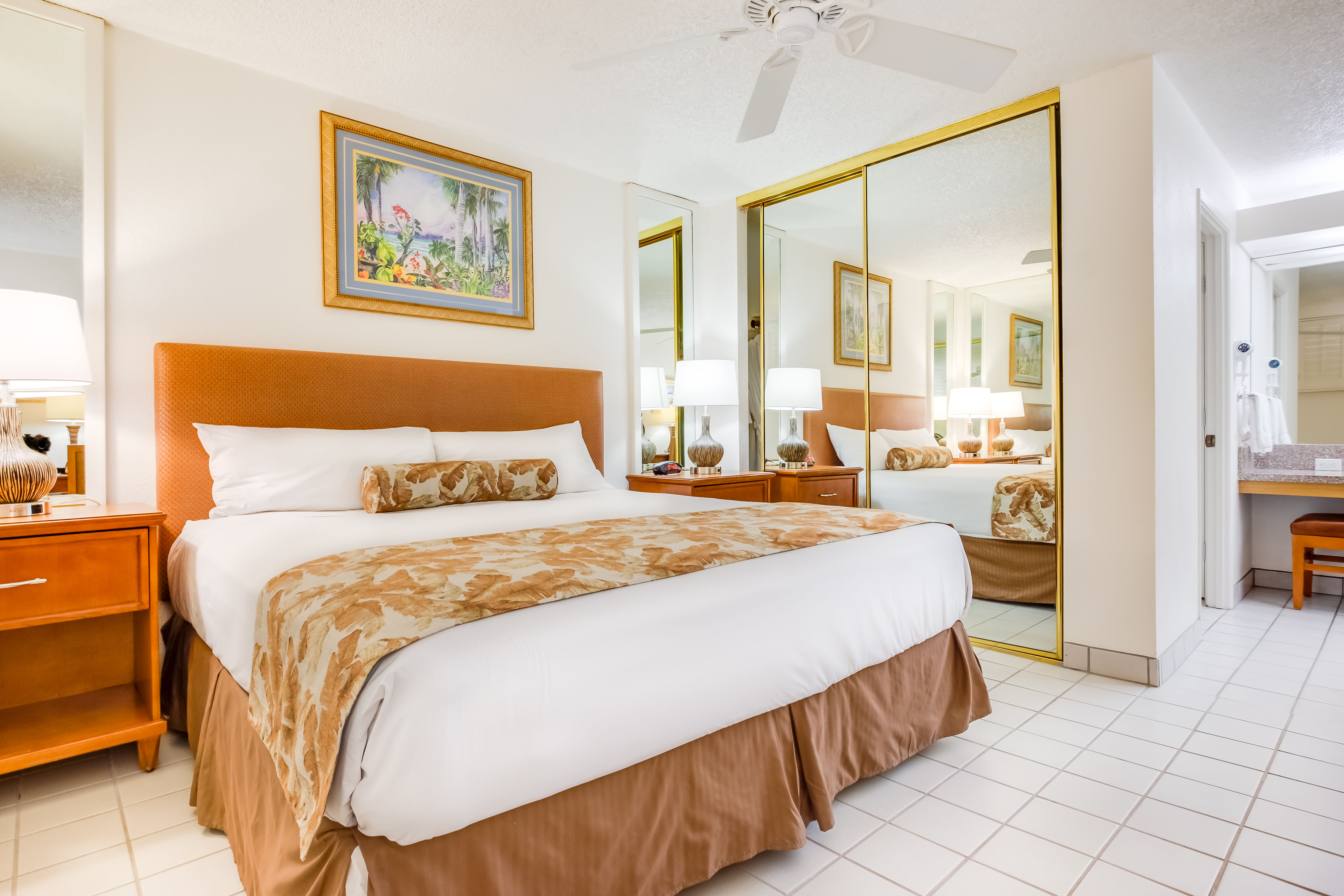 image A serene bedroom adorned with elegant furnishings, reflecting natural light, and complemented by tasteful artwork.