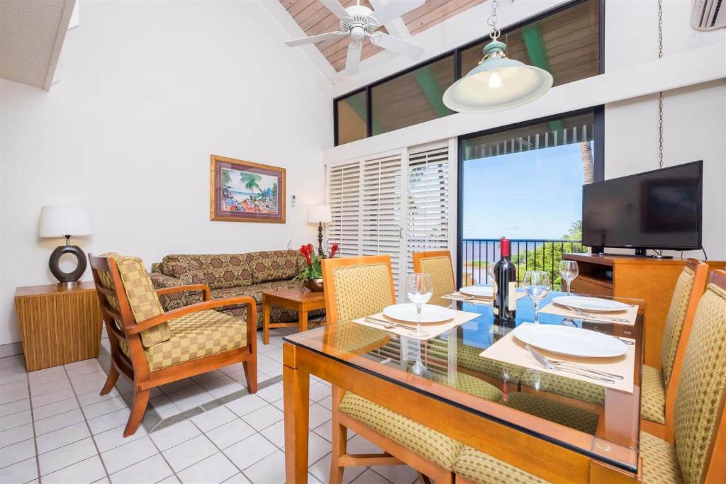 image A welcoming living space featuring comfortable seating, vibrant decor, and stunning views through expansive windows.
