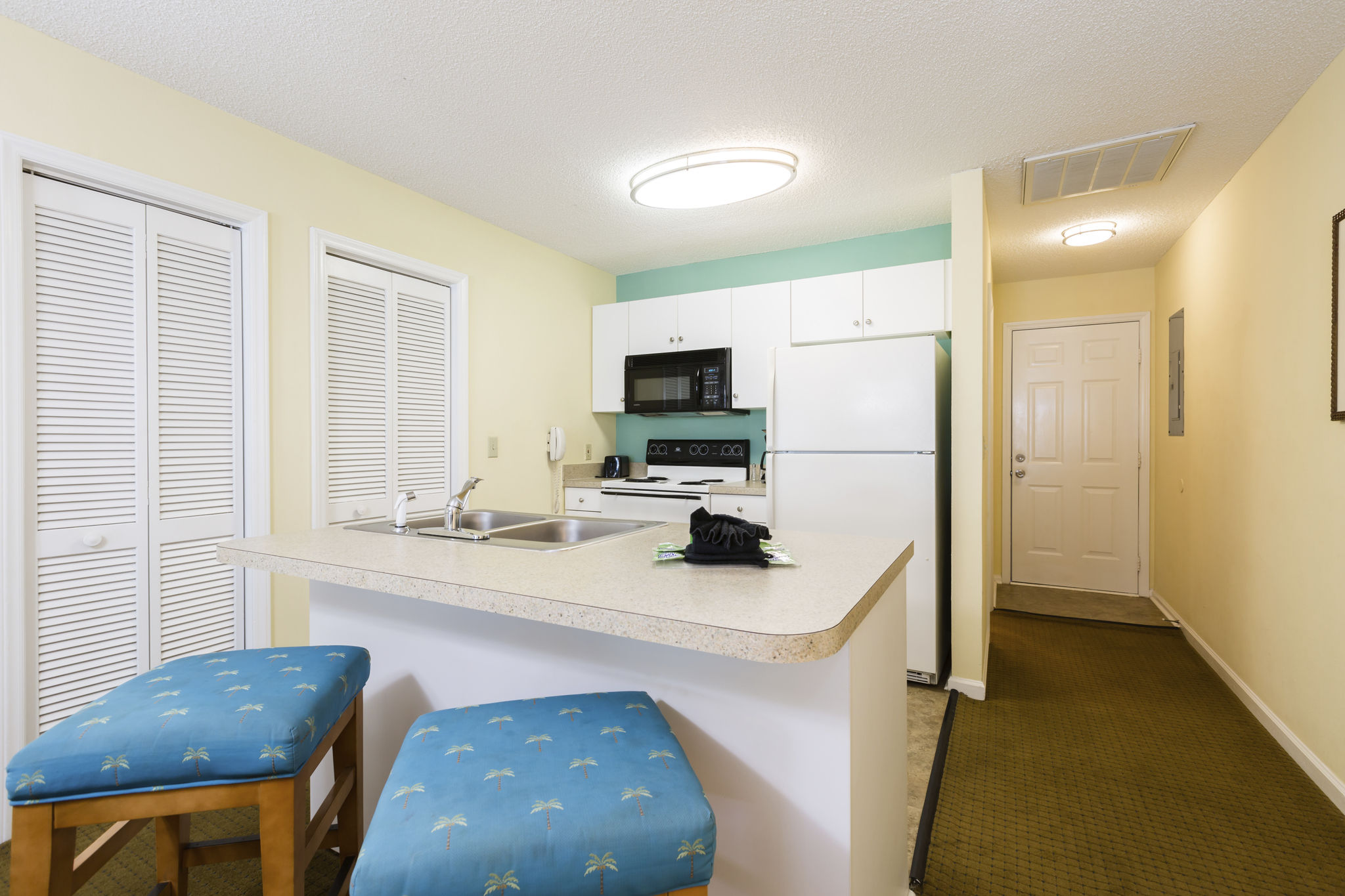 image Step into the fully-equipped kitchen of this condo, featuring modern appliances and stylish decor, perfect for whipping up your favorite meals.