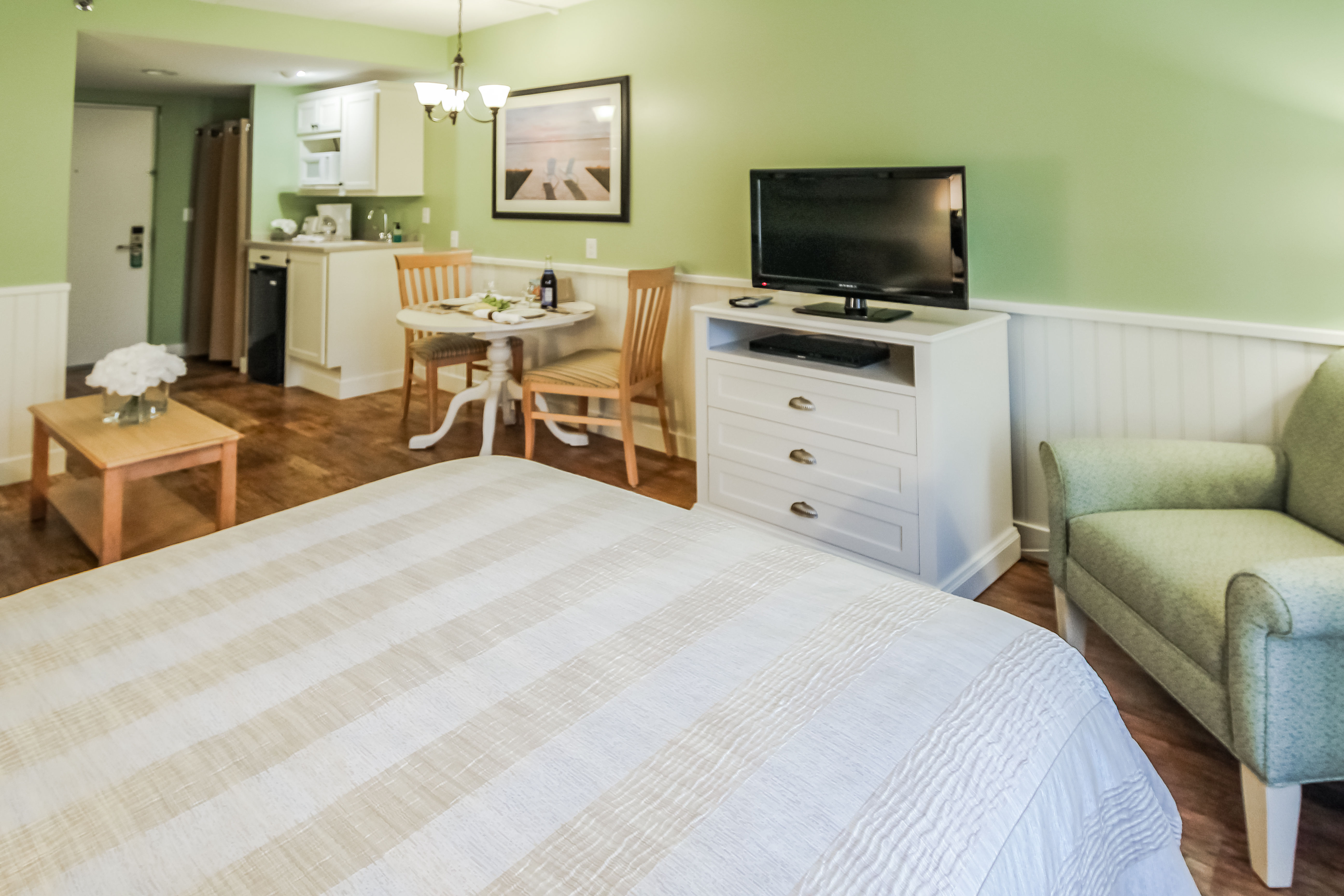 image This cozy studio features a Murphy bed, sleeper sofa, and kitchenette equipped with a mini fridge, microwave, toaster, and coffee maker, perfect for couples or small families.