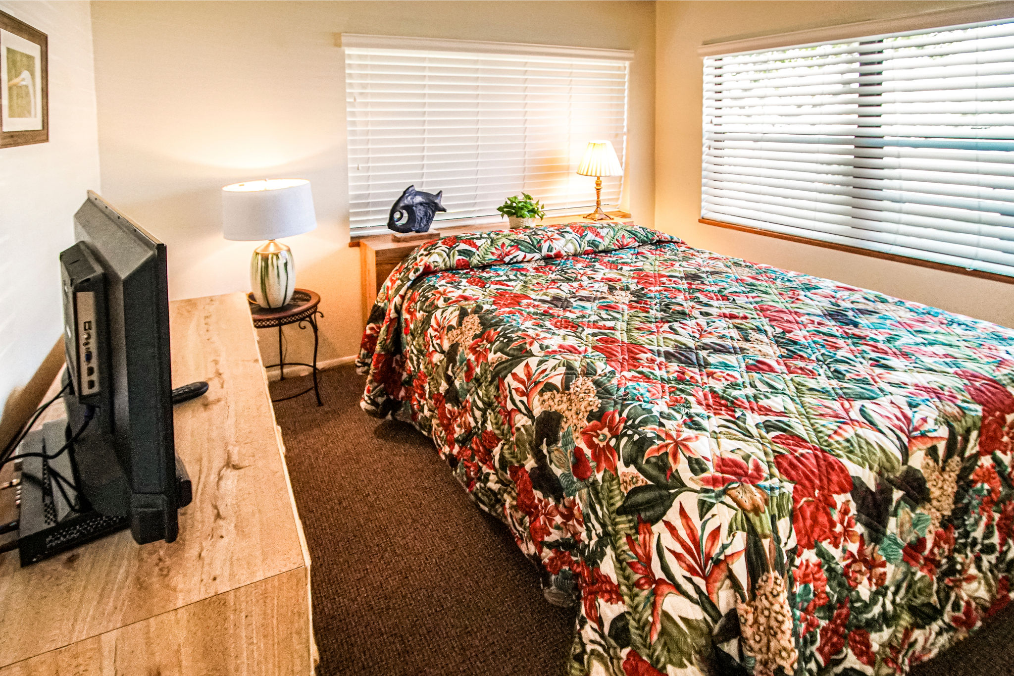 image The inviting guest bedroom offers a charming atmosphere with comfortable bedding and a Smart TV, perfect for unwinding after a day at the beach.