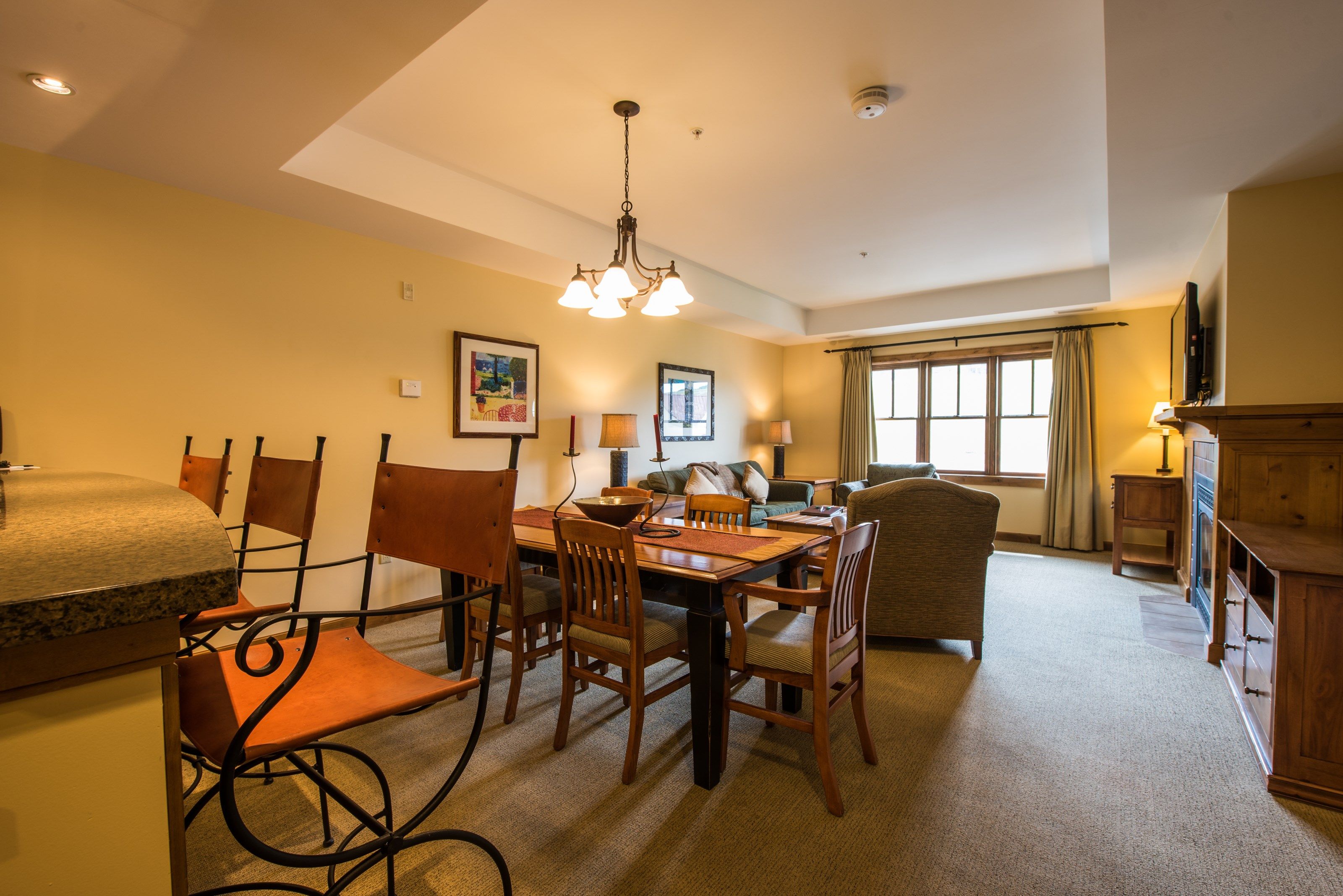 image Find peace and relaxation with your close friends and family in this stunning living room featuring natural decor.