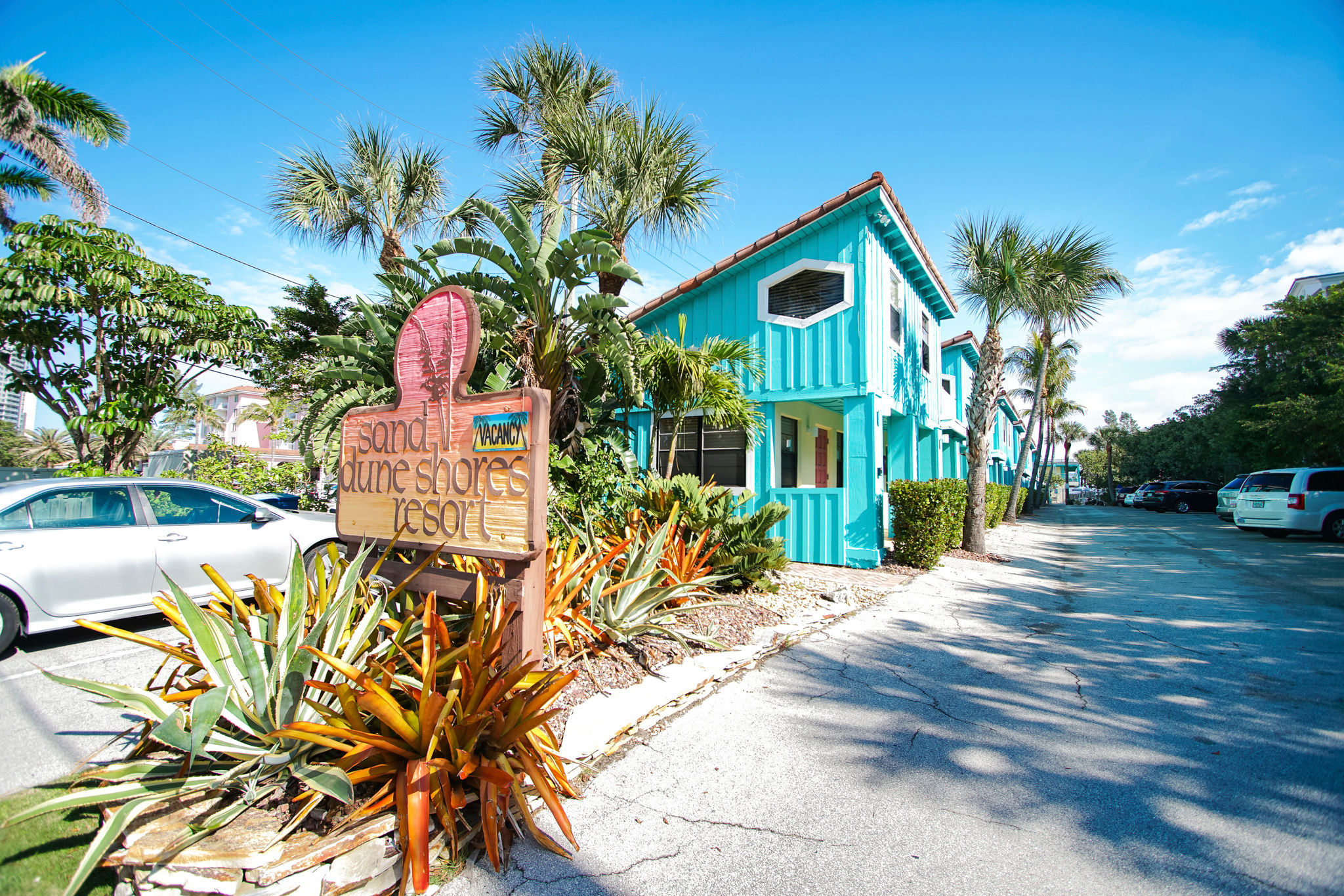 image Welcome to the vibrant entry of Sand Dune Shores Resort, your gateway to a cozy oceanfront studio just a stone's throw from the beach.