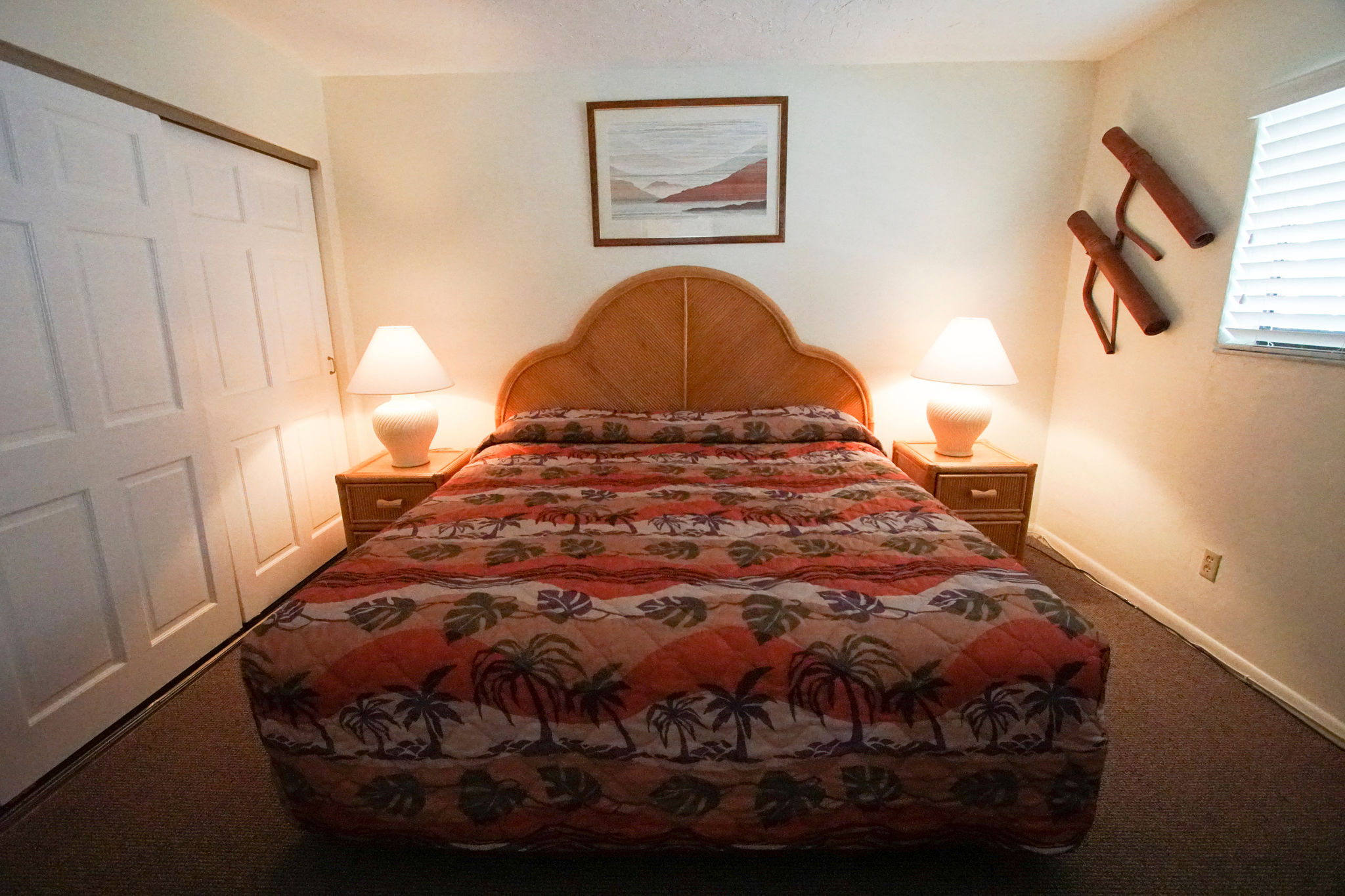 image Unwind in the peaceful bedroom featuring a comfortable queen-size bed and soft lighting, perfect for a romantic getaway.
