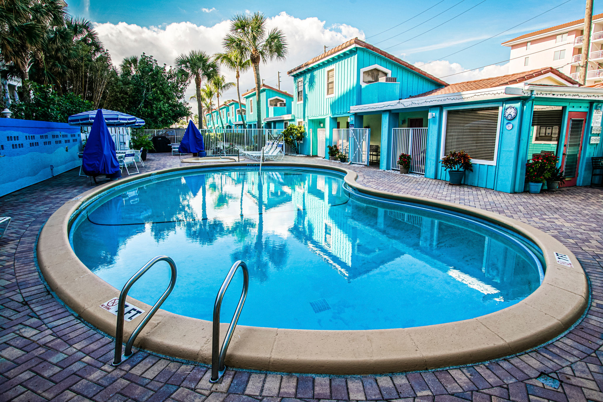 image Take a refreshing dip in the inviting pool, a serene oasis for couples and small families alike.