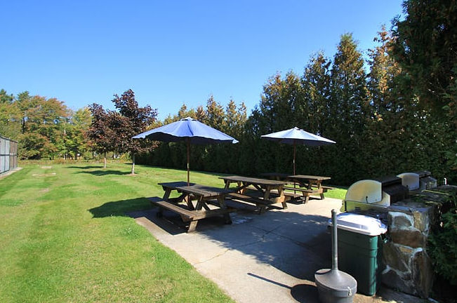 image Step onto the patio and breathe in fresh air, overlooking a manicured lawn perfect for a picnic or playtime.