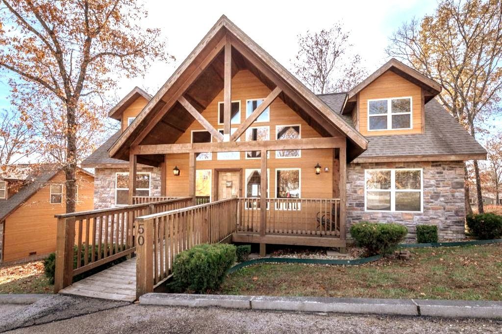 image Experience luxury and comfort at this stunning Branson condo featuring an inviting front porch and beautiful architecture, perfect for family gatherings.