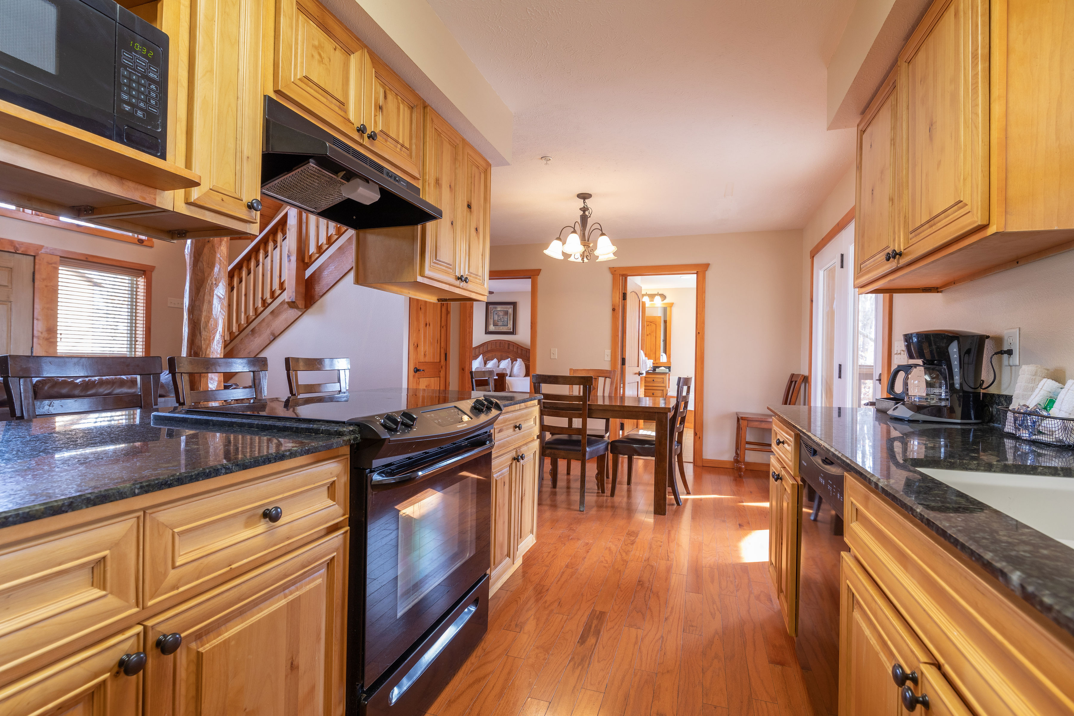 image Bright and spacious, this kitchen seamlessly transitions into a dining space, perfect for sharing meals and making memories together with loved ones.